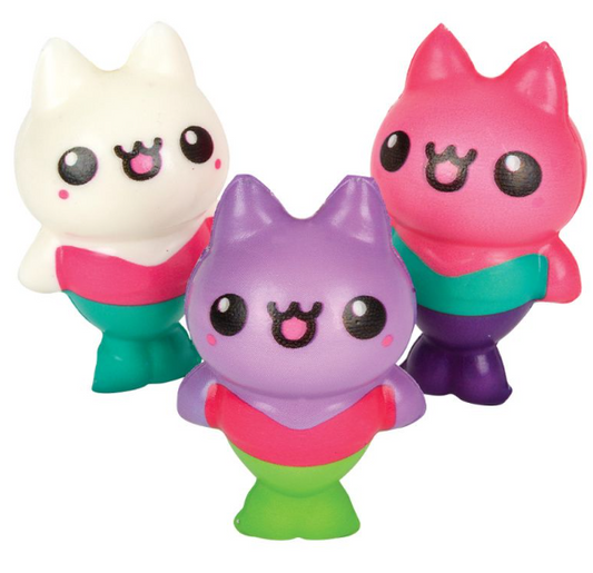 Three kitty cat mermaid squishies. From left to right, they are white, purple, and pink.