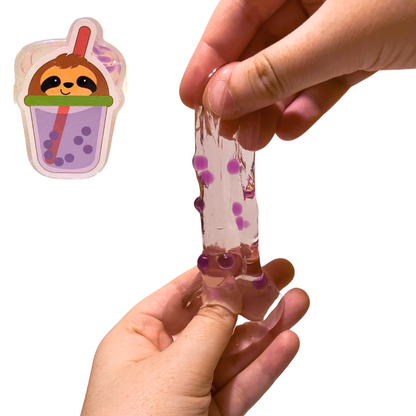In the top left corner is the sloth themed Boba Tea Inspired Slime. Larger, in the bottom right corner, a person's hands stretch out the slime, demonstrating the slightly watery texture.