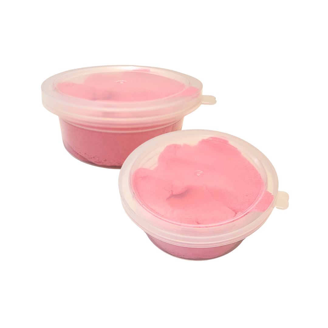 Two containers of pink Sticky Sand.