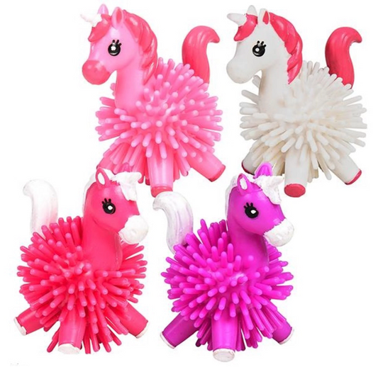 Four Unicorn Hedge Balls. On the top row there is a light pink unicorn and a white unicorn with hot pink accents. On the bottom row there is a hot pink unicorn with white accents and a purple unicorn with white accents.