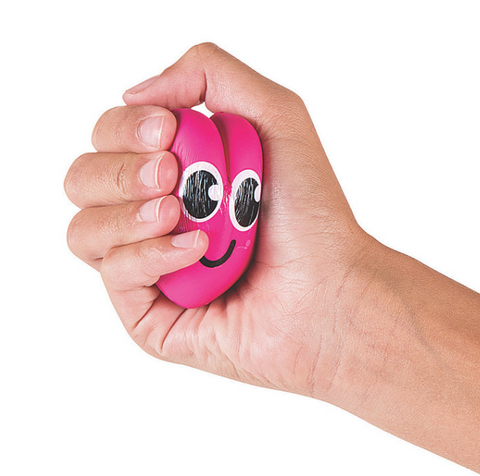 A person's hand squishies a pink happy heart slow rise squishy.