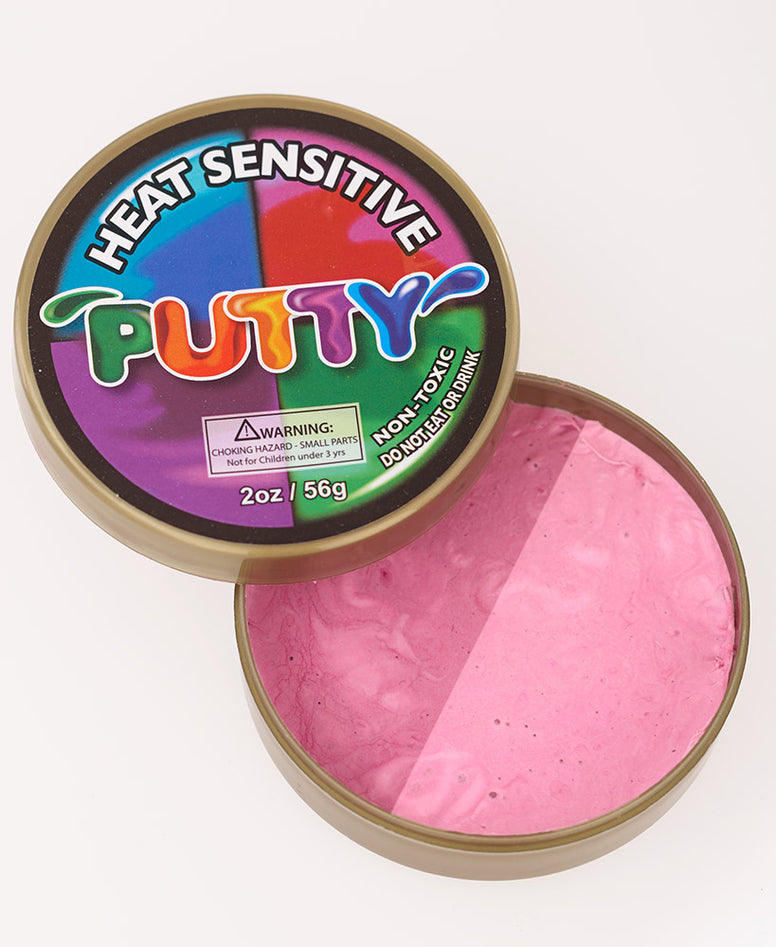An open container of pink heat sensitive putty. Putty is spit down the middle to show the color when heated and the color when cool.