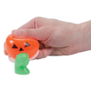 Pumpkin Oozing Slime Halloween Creature being held by a person's hand and squeezed. Green slime is oozing out.