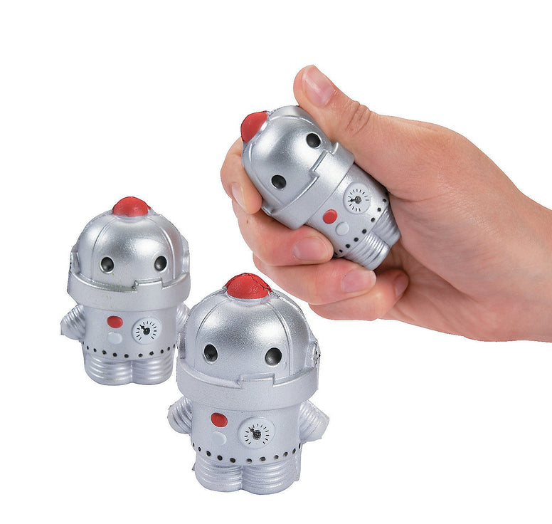 Three robo pal stress toys. The robots are silver with red details. A person's hand holds one of the robots and squeezes it lightly.